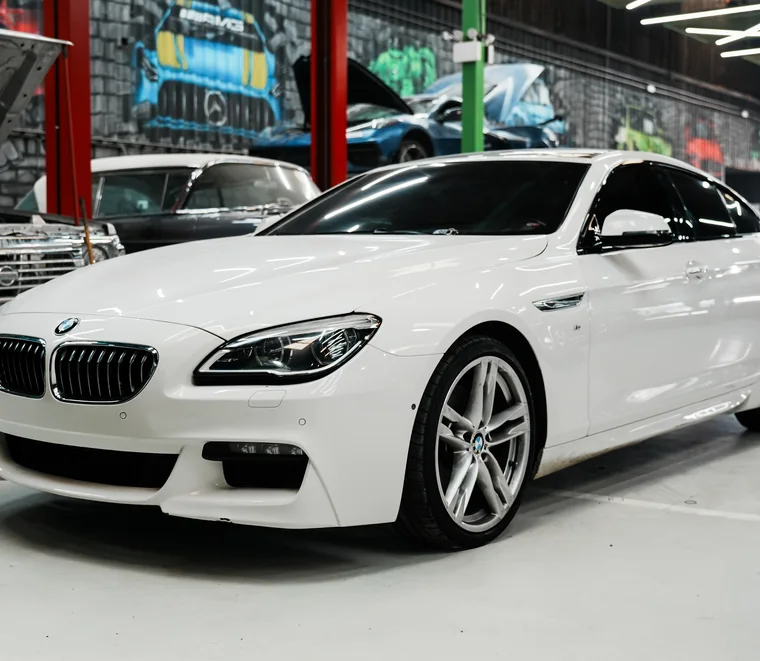 White BMW 6 Series Gran Coupe in for service at the System X Car Care workshop in Al Quoz, Dubai, Abu Dhabi.